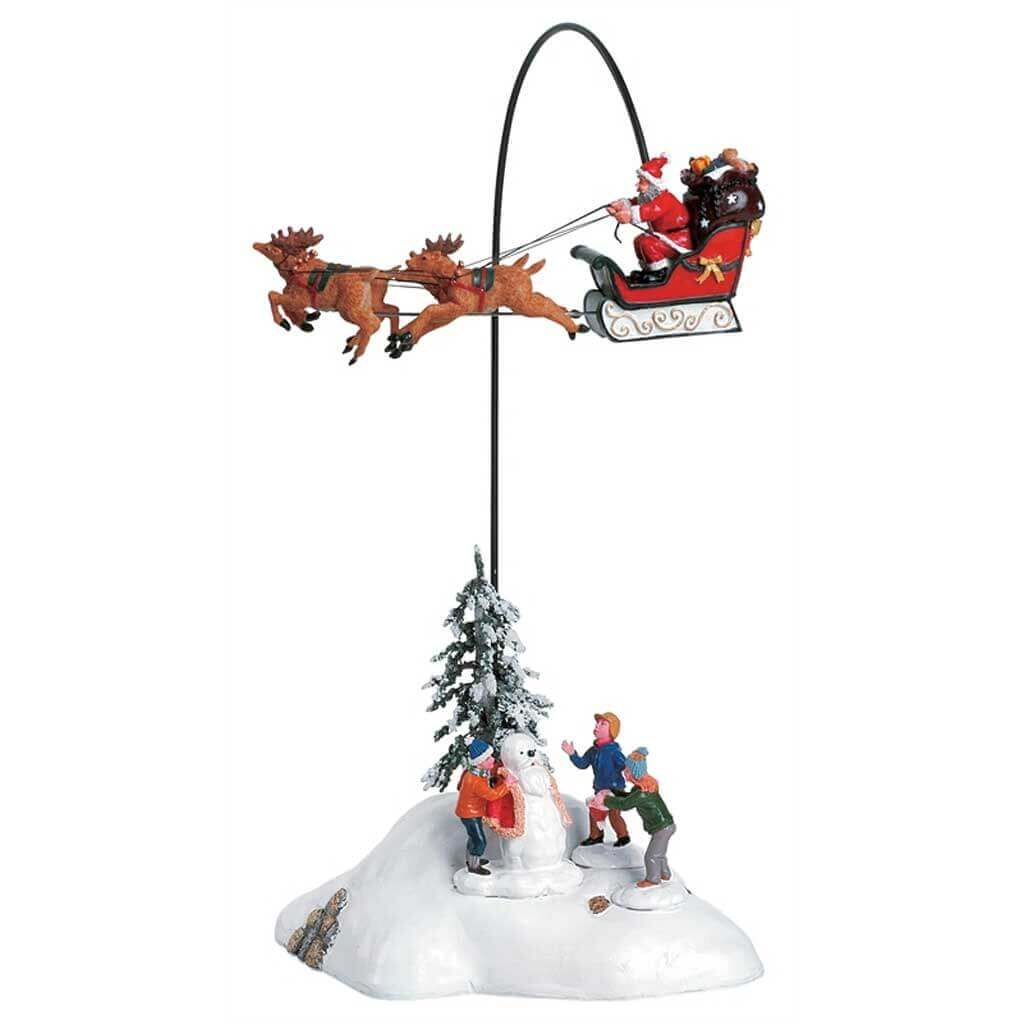 lemax-santa-claus-is-coming-to-town-set-de-4-tra-neau-rotatif image 1