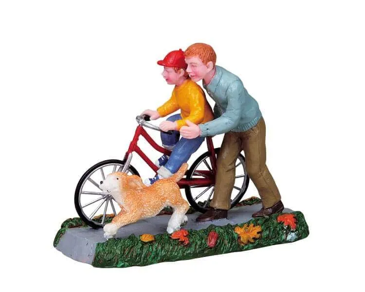 lemax-learning-to-ride-figurine-enfant-v-lo-village-miniature image 1